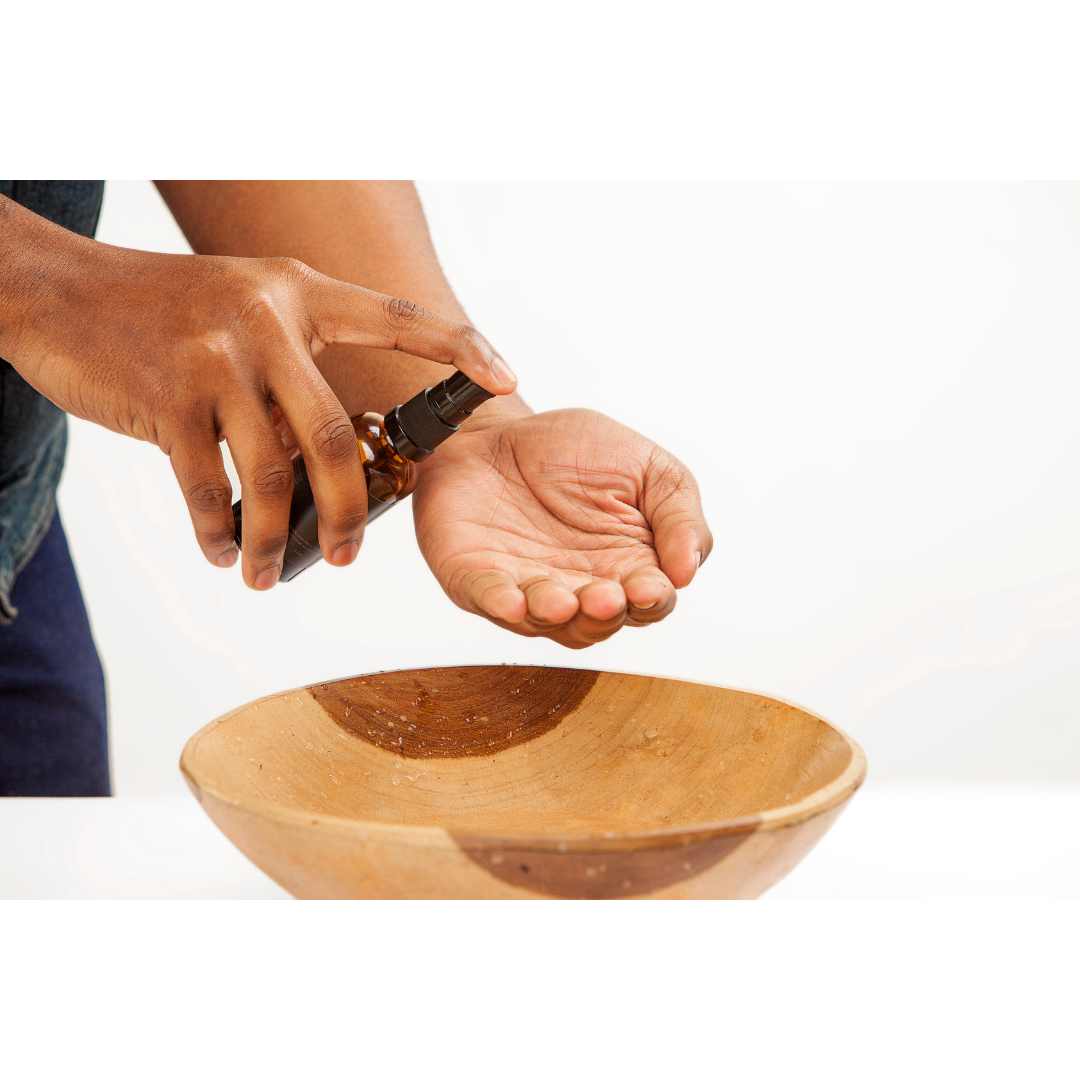 Hand pumping cleanser into the palm of the hand