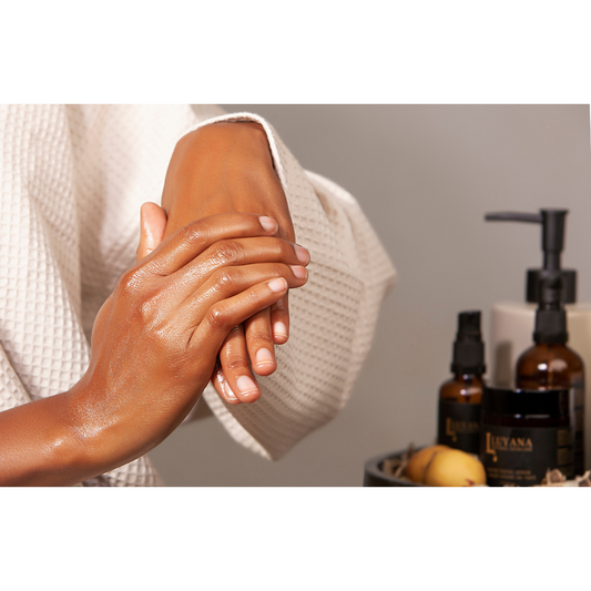 Woman rubbing body butter into her hands