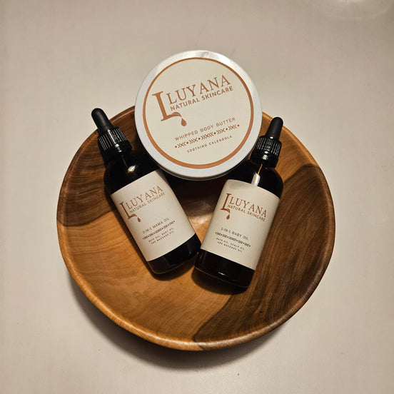 Luyana skincare products on a wooden tray with a neutral background