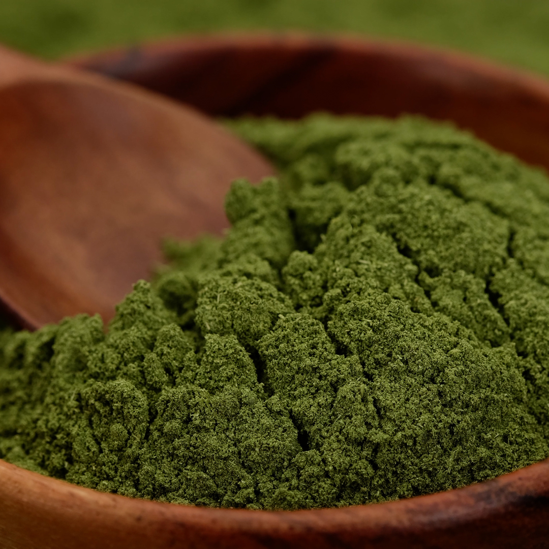 Wooden bowl with Moringa Powder in it