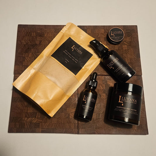 Luyana Natural Skincare products on a wooden tray