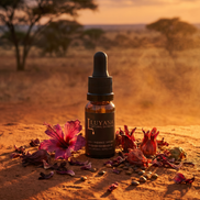 Luyana skincare bottle with flowers on a desert landscape