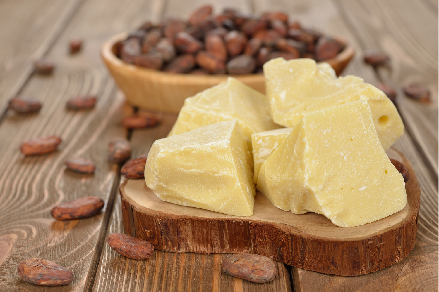 Chunks of Shea Butter on top of wooden slab